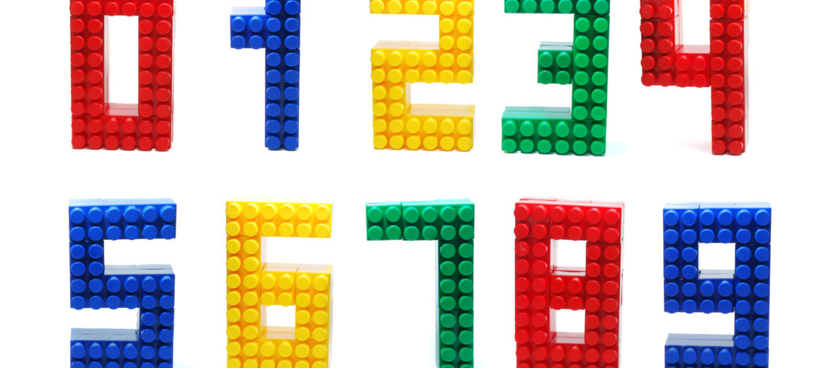 Colored Digits Set made of Plastic Toy Blocks (Lego) Isolated on White Background