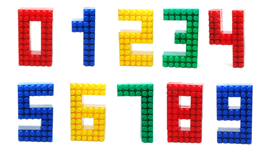 Colored Digits Set made of Plastic Toy Blocks (Lego) Isolated on White Background