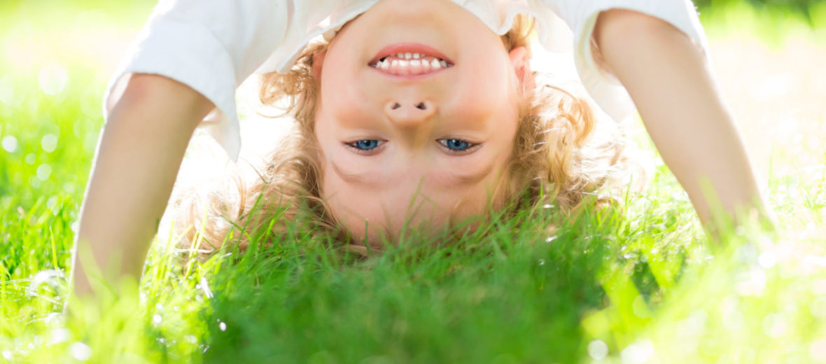 Child Doing Headstand - Why Summer Day Camps Are So Beneficial For Preschoolers